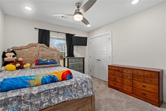 carpeted bedroom with ceiling fan