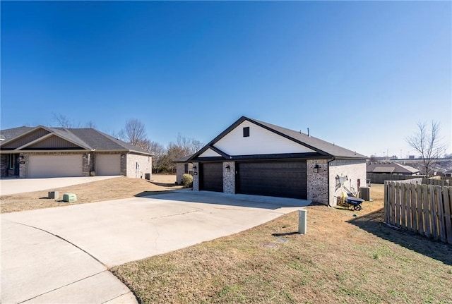 view of front of home featuring a garage and a front lawn