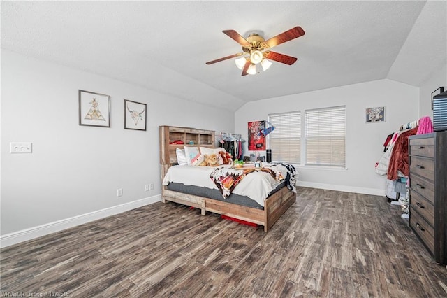 bedroom featuring ceiling fan, lofted ceiling, and dark hardwood / wood-style flooring