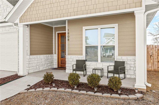 entrance to property featuring covered porch