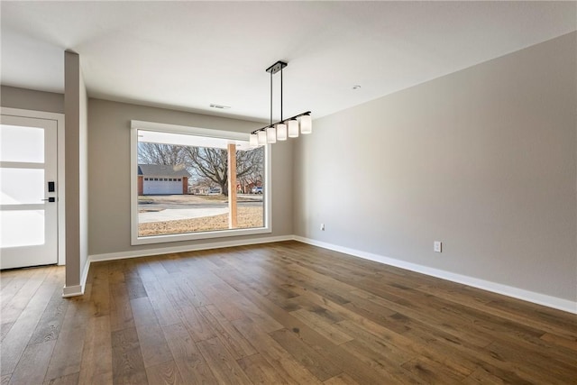 unfurnished dining area featuring hardwood / wood-style flooring