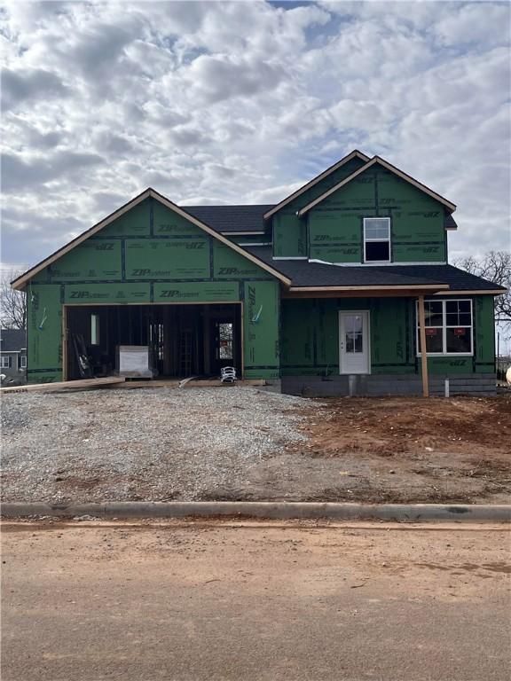 unfinished property featuring a garage