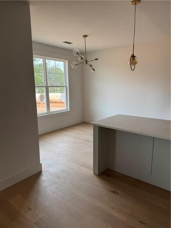 4750 Cowboy St, Springdale, AR 72762 - unfurnished dining area featuring light wood-style floors, baseboards, and a chandelier