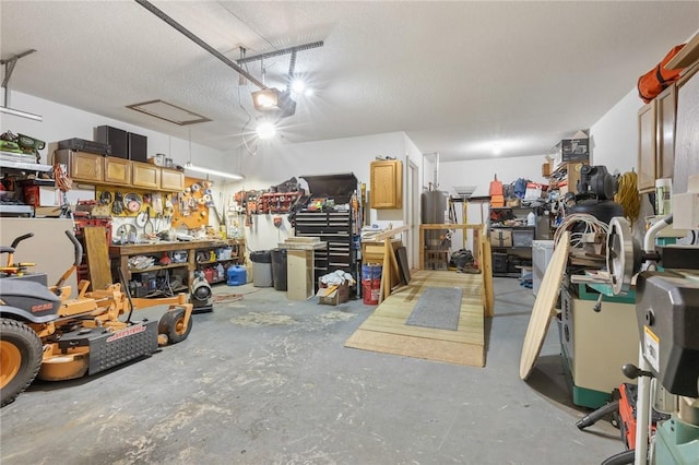 garage featuring a garage door opener and a workshop area