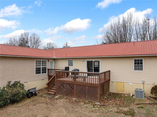 back of property featuring a wooden deck and central AC