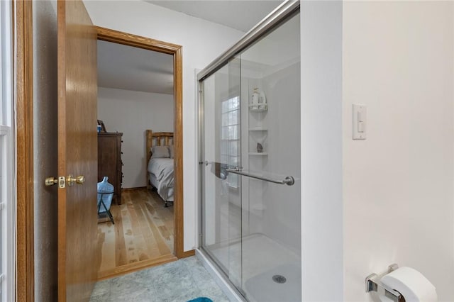 bathroom with a shower with shower door