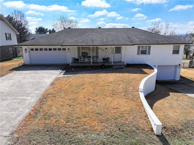 view of front of property with a garage and a porch