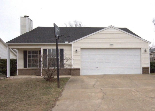 ranch-style home featuring a garage