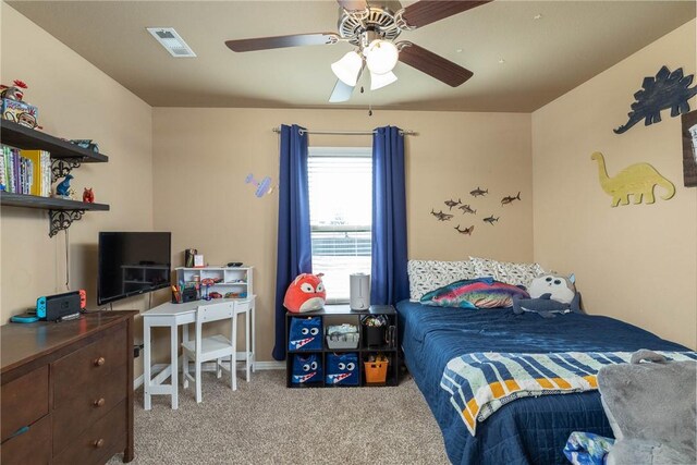 bedroom featuring light colored carpet and ceiling fan
