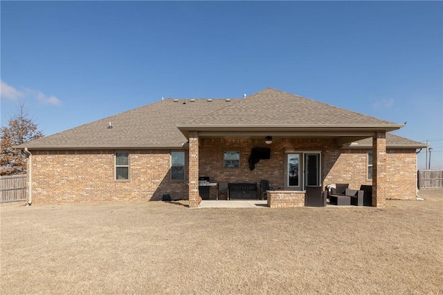 rear view of property featuring an outdoor hangout area and a patio