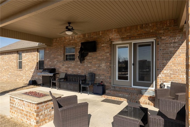 view of patio / terrace with ceiling fan, a grill, and an outdoor living space with a fire pit