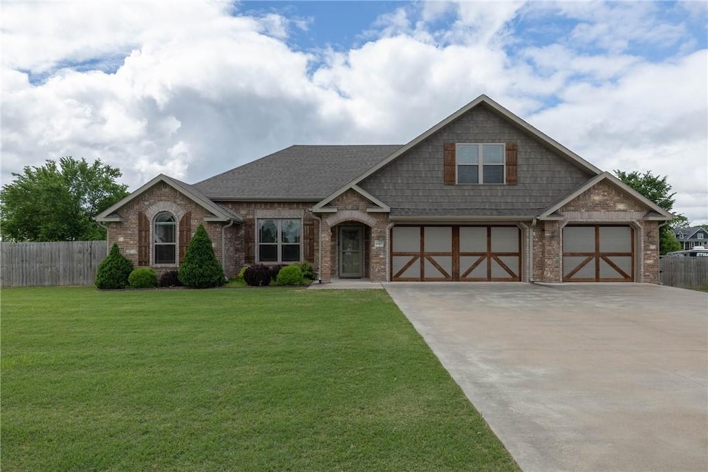 13427 Meadow Rdg, Fayetteville, AR 72704 - craftsman inspired home featuring brick siding, driveway, a garage, and roof with shingles