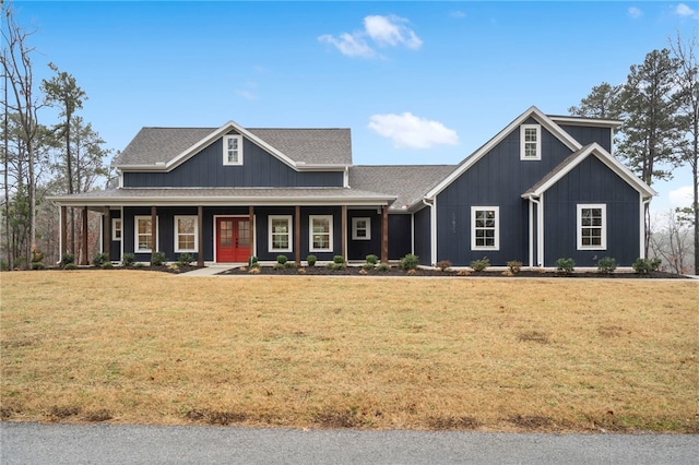 view of front of home with a front yard and a porch