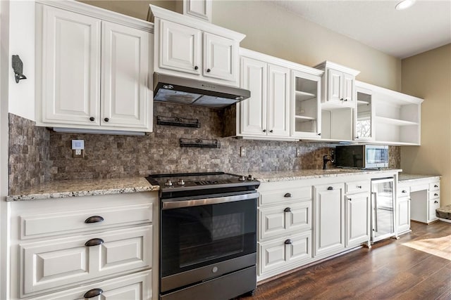 kitchen with appliances with stainless steel finishes, wine cooler, white cabinetry, and under cabinet range hood