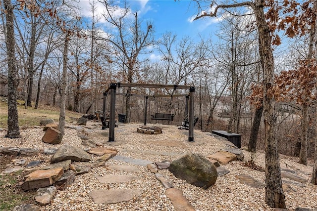 view of yard with a fire pit