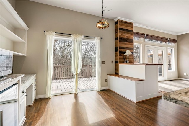 kitchen featuring dark wood-type flooring, pendant lighting, white cabinets, and open shelves