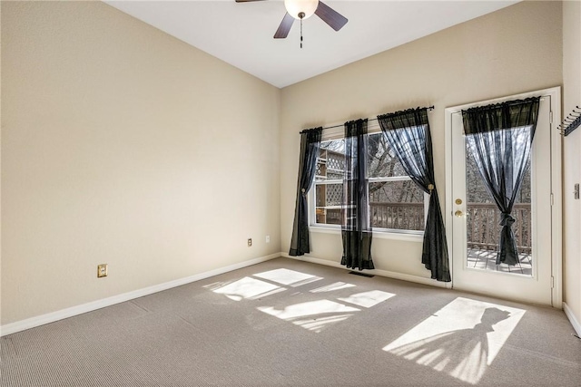 empty room featuring a ceiling fan, carpet flooring, visible vents, and baseboards