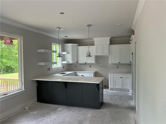 18 Selland Ln, Bella Vista, AR 72715 - kitchen featuring a peninsula, white cabinets, ornamental molding, decorative light fixtures, and light countertops