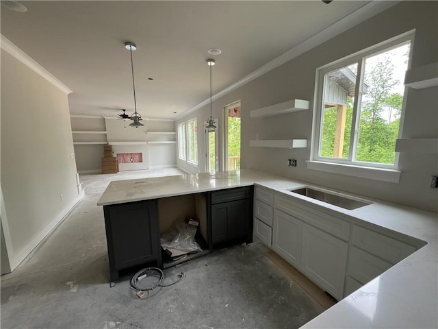18 Selland Ln, Bella Vista, AR 72715 - kitchen with open shelves, healthy amount of natural light, open floor plan, a sink, and crown molding