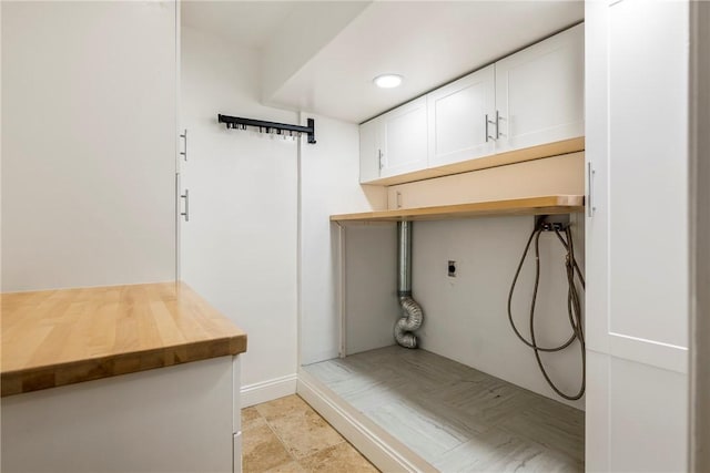 laundry area featuring cabinets, electric dryer hookup, and washer hookup