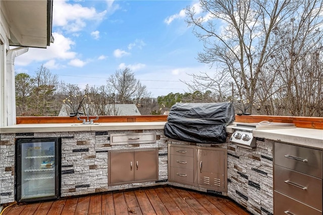 8116 Pine Ln, Rogers, AR 72756 - wooden deck with area for grilling and wine cooler