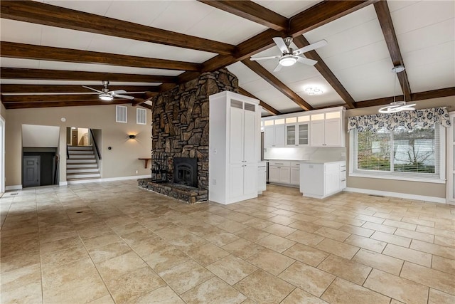 8116 Pine Ln, Rogers, AR 72756 - unfurnished living room with a ceiling fan, stairway, beamed ceiling, a fireplace, and light tile patterned floors