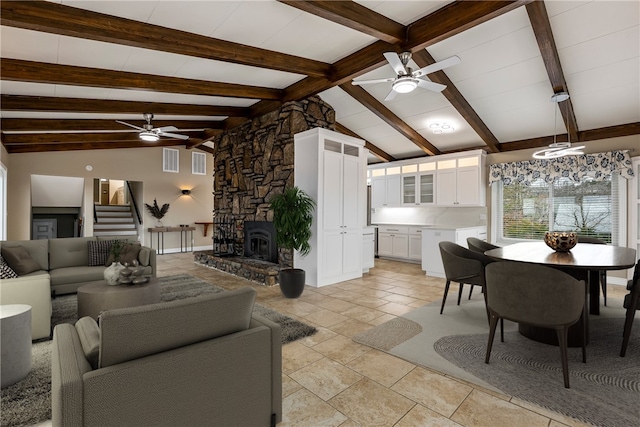 living room with vaulted ceiling with beams and ceiling fan