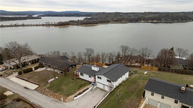 birds eye view of property featuring a water view