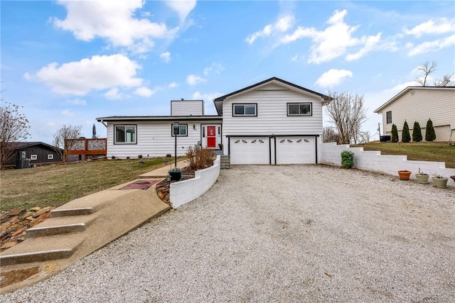 8116 Pine Ln, Rogers, AR 72756 - view of front of property with driveway, a garage, and a front lawn