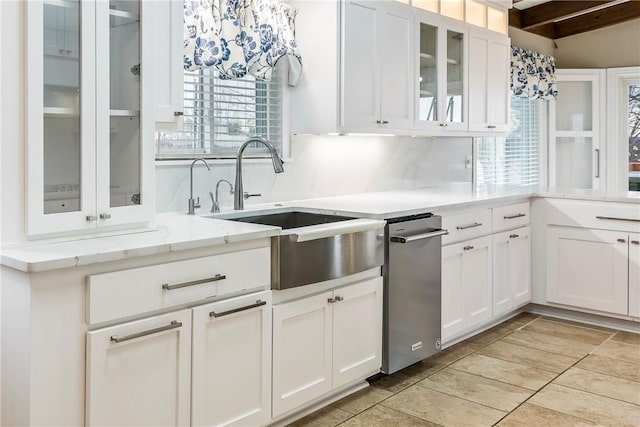 8116 Pine Ln, Rogers, AR 72756 - kitchen featuring dishwasher, white cabinets, glass insert cabinets, light stone countertops, and decorative backsplash