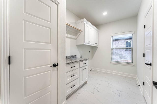 laundry room with cabinets and hookup for an electric dryer