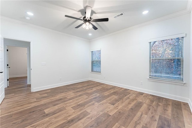 empty room featuring crown molding, ceiling fan, and hardwood / wood-style flooring