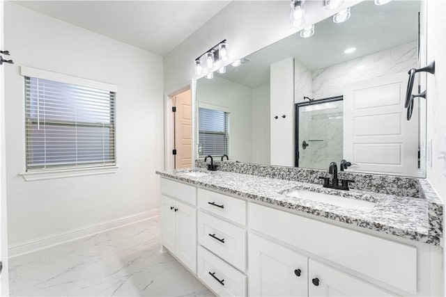 bathroom featuring vanity and a shower with shower door