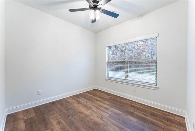 unfurnished room with ceiling fan and dark hardwood / wood-style flooring