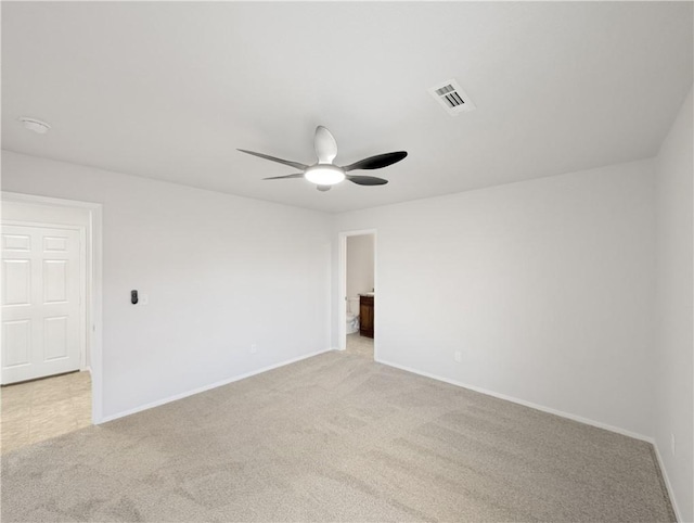 unfurnished room featuring light carpet and ceiling fan