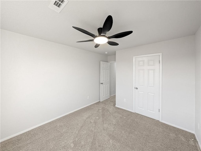 unfurnished bedroom featuring ceiling fan and light carpet