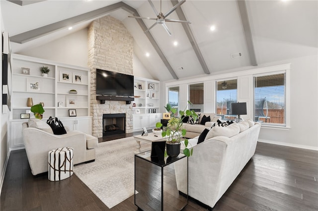 living room with ceiling fan, high vaulted ceiling, a fireplace, dark hardwood / wood-style flooring, and beamed ceiling