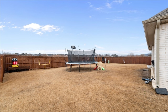 view of yard with a trampoline