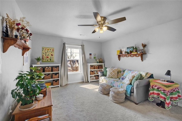 recreation room featuring ceiling fan and carpet flooring