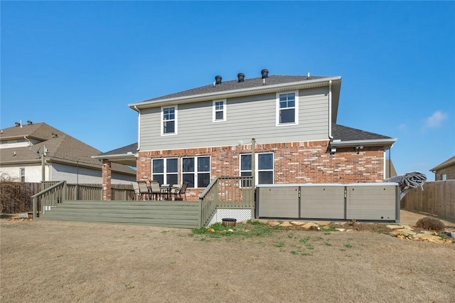 back of house featuring a deck