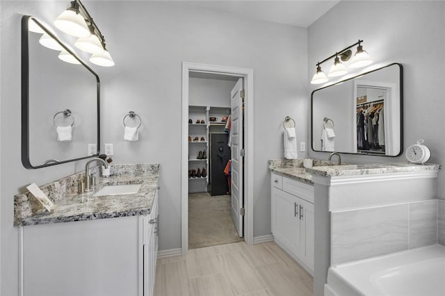 bathroom featuring vanity and a bathtub