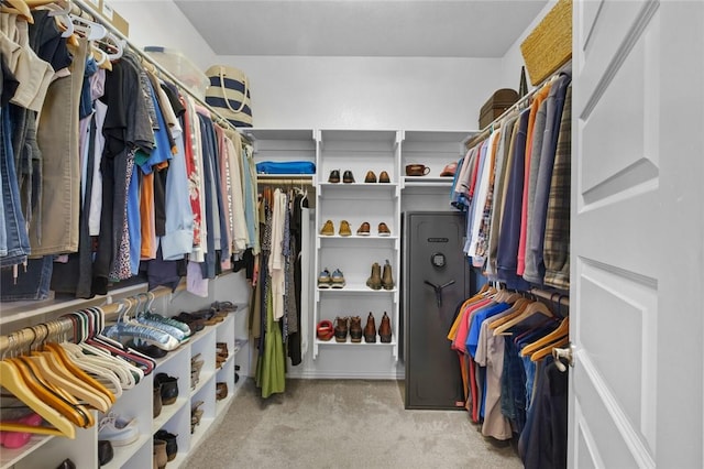 spacious closet with light colored carpet