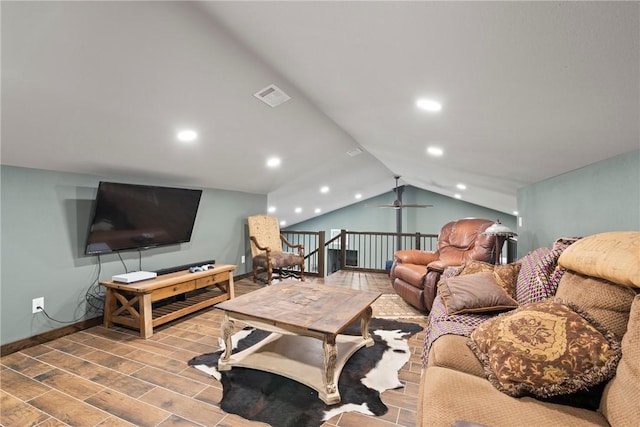 living area featuring lofted ceiling, recessed lighting, visible vents, wood tiled floor, and baseboards