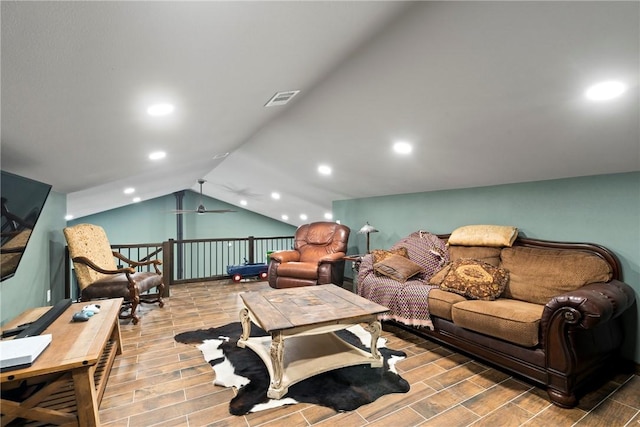 living room with lofted ceiling, recessed lighting, visible vents, and wood tiled floor