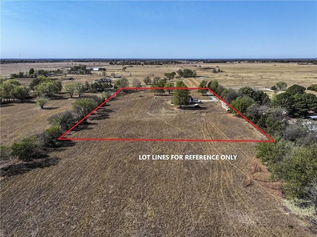 birds eye view of property featuring a rural view