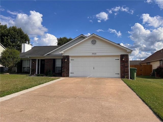 single story home featuring a garage and a front yard