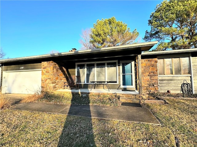 view of front facade featuring a garage and covered porch