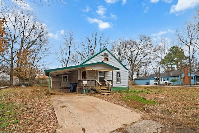 bungalow-style house with a carport and covered porch