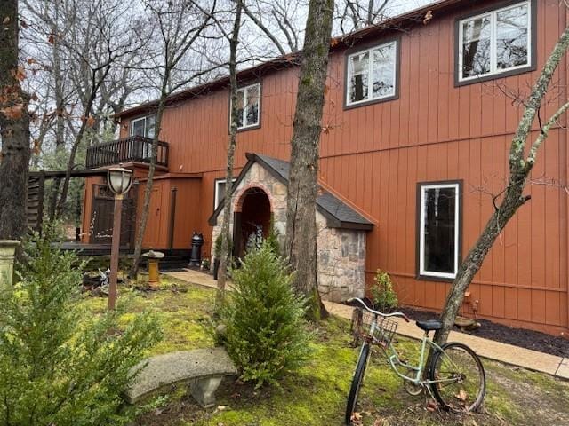 back of property with a balcony