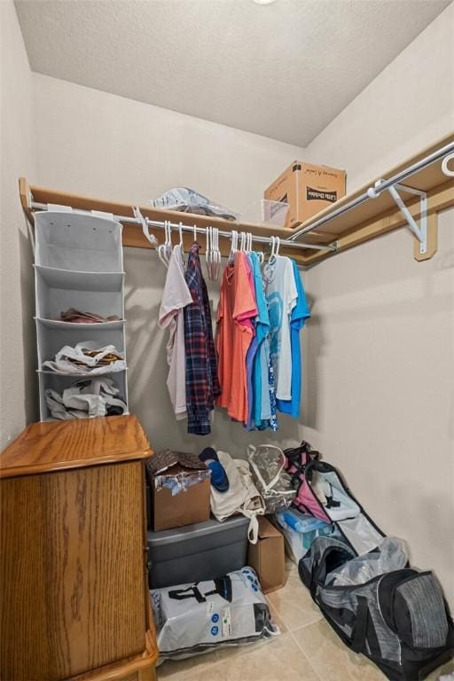 walk in closet featuring tile patterned flooring